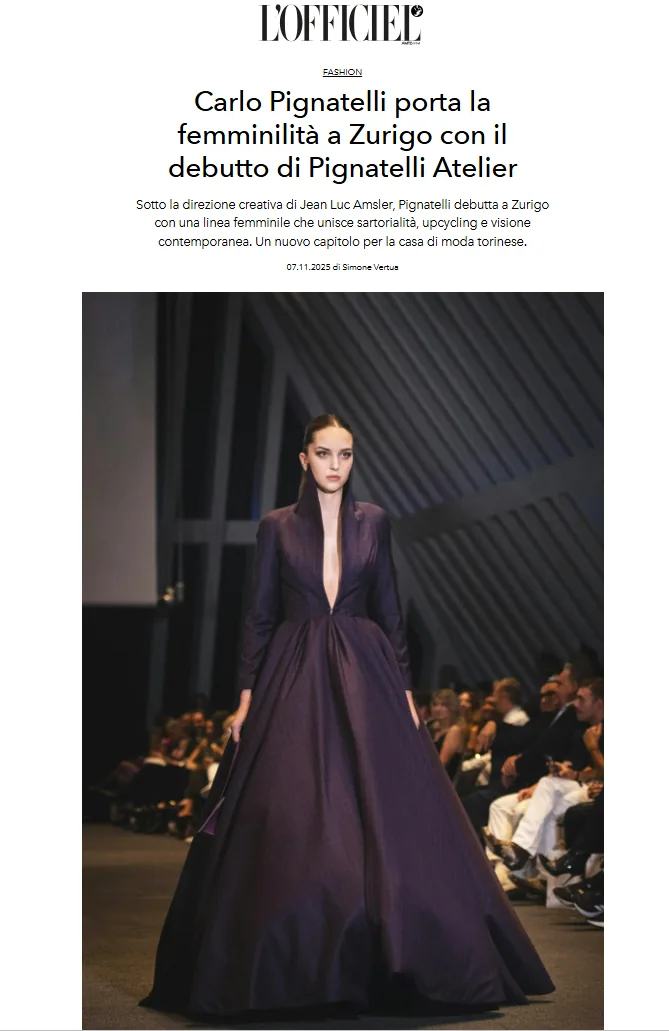 Model in a deep purple gown with a structured collar, holding a small clutch